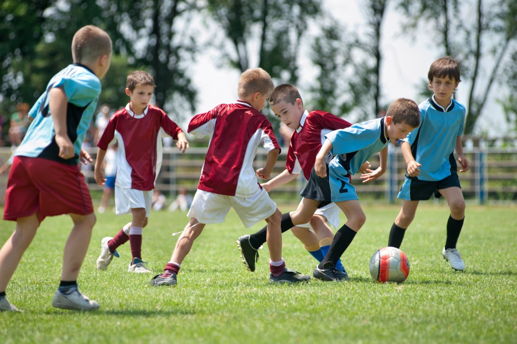 Kids Running and Playing Soccer